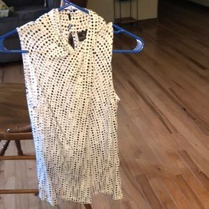 Black and white sleeveless blouse